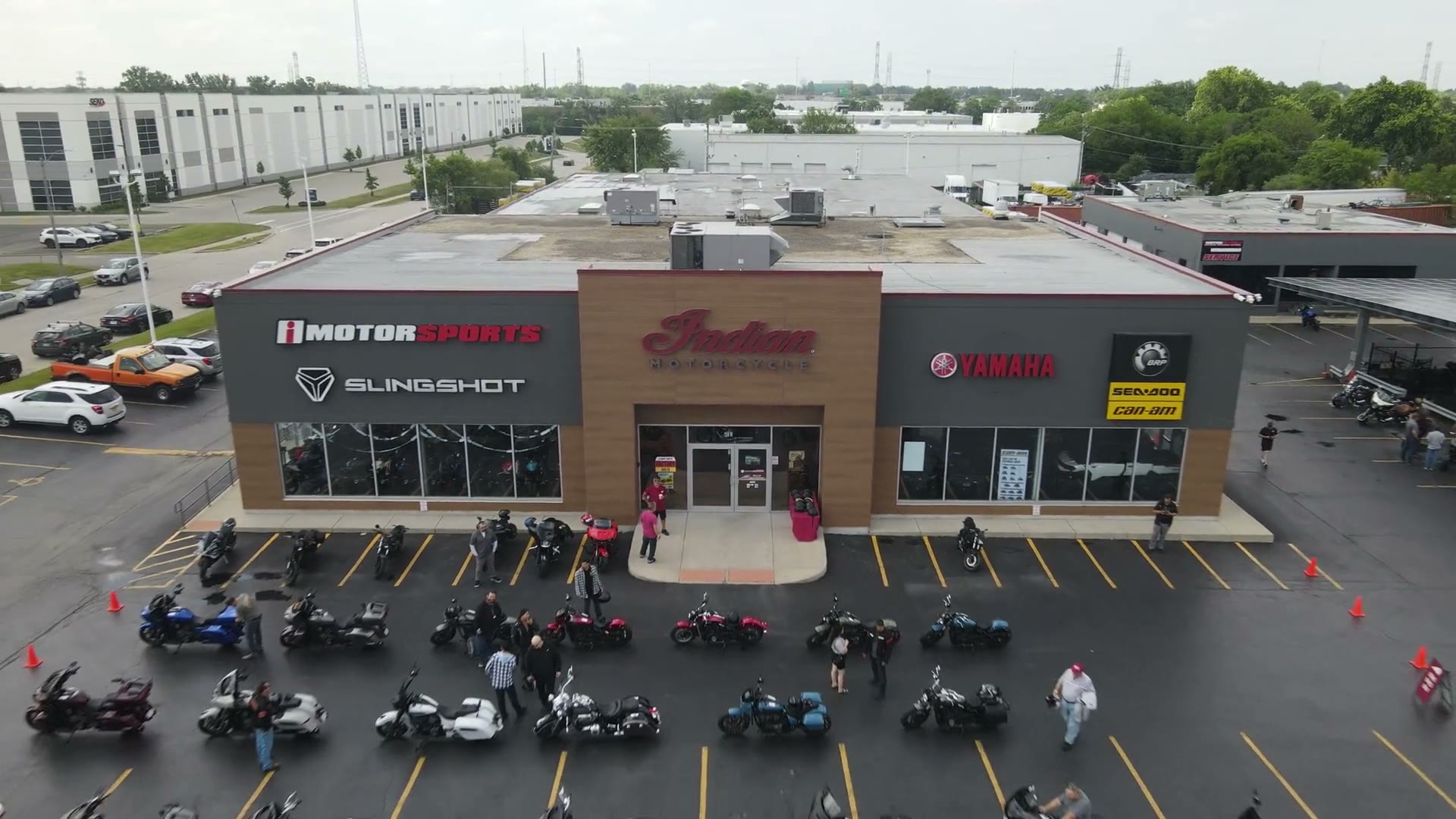 Rows of pre-owned motorcycles lined up outside the iMotorsports Chicago showroom in Elmhurst