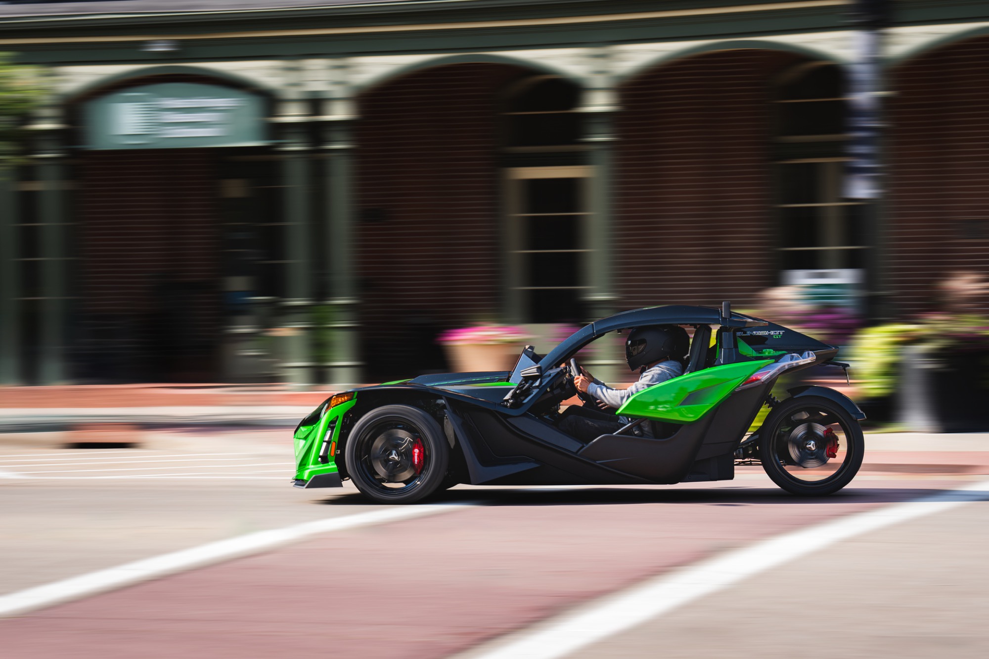 Polaris Slingshot GT driving in downtown